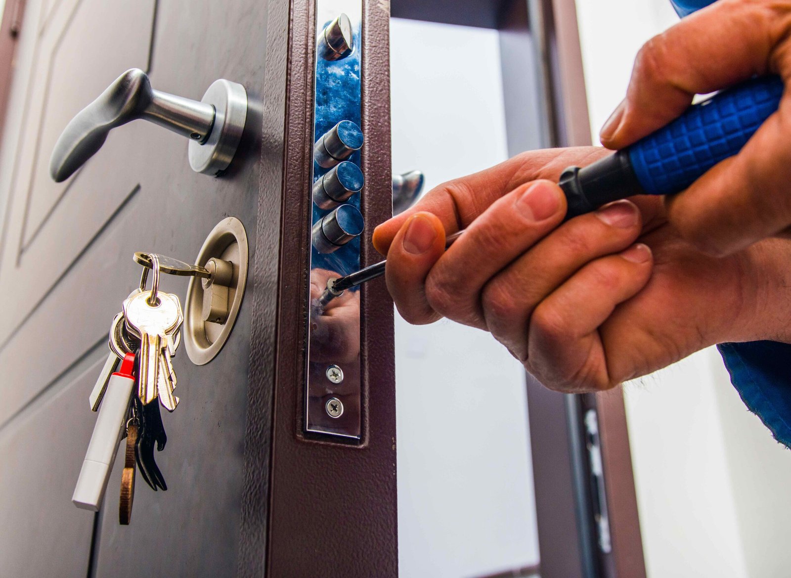 a professional Blueline Locksmith technician providing commercial locksmith services, showcasing a secure lock installation on a business entrance door, emphasizing expertise in enhancing business security.