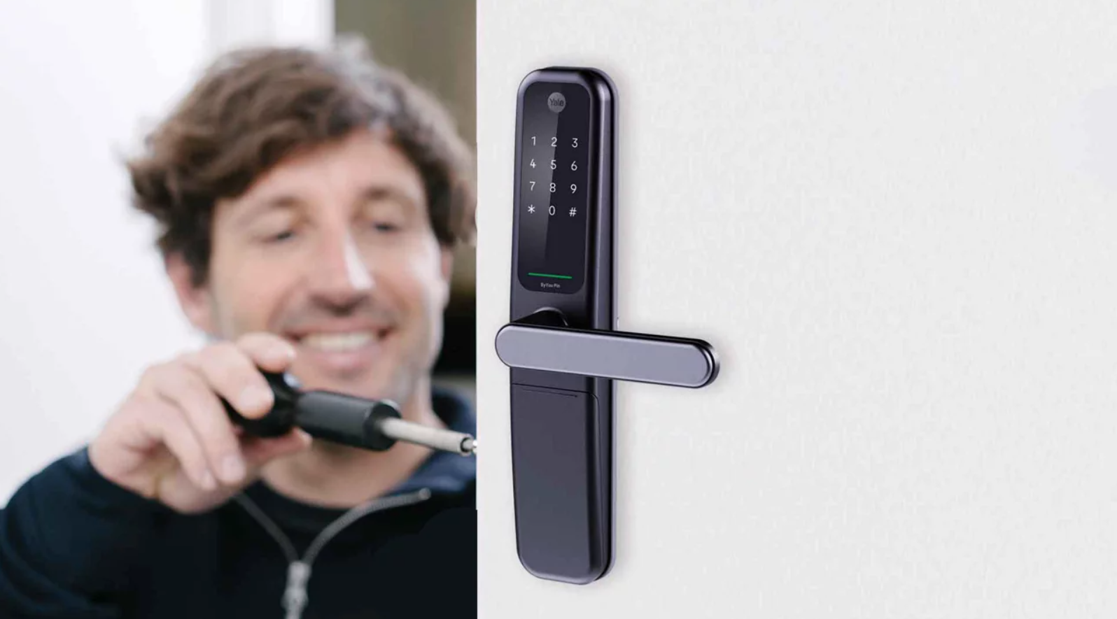 expert technician of Blueline Locksmith installing fingerprint lock.